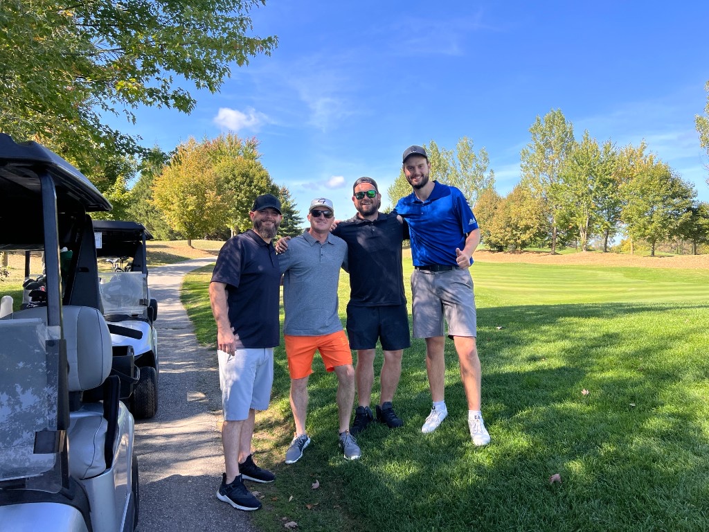 Jackman team members together at a golf tournament