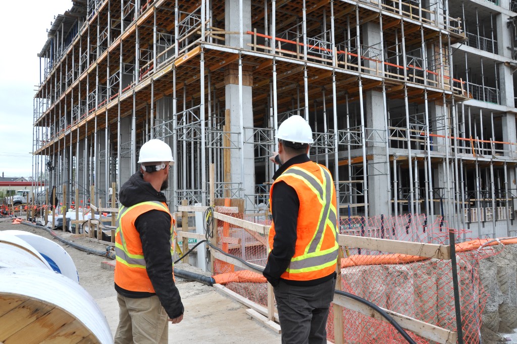 Jackman Construction site superintendents reviewing a multi-storey build under construction