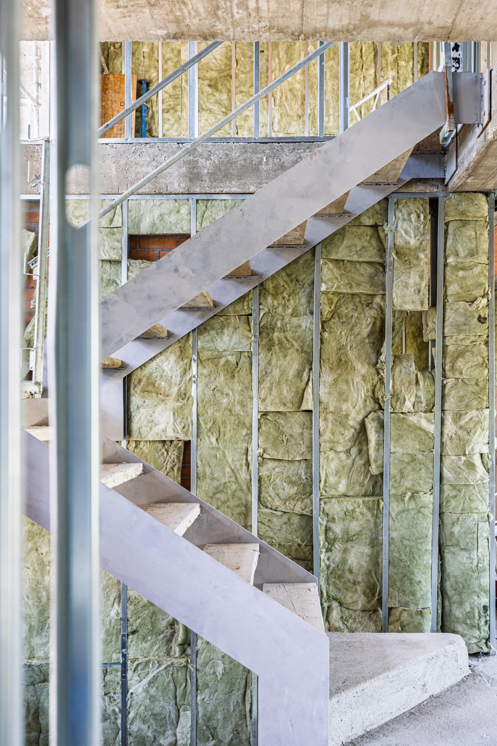 Mineral wool batt insulation installed between commercial steel studs