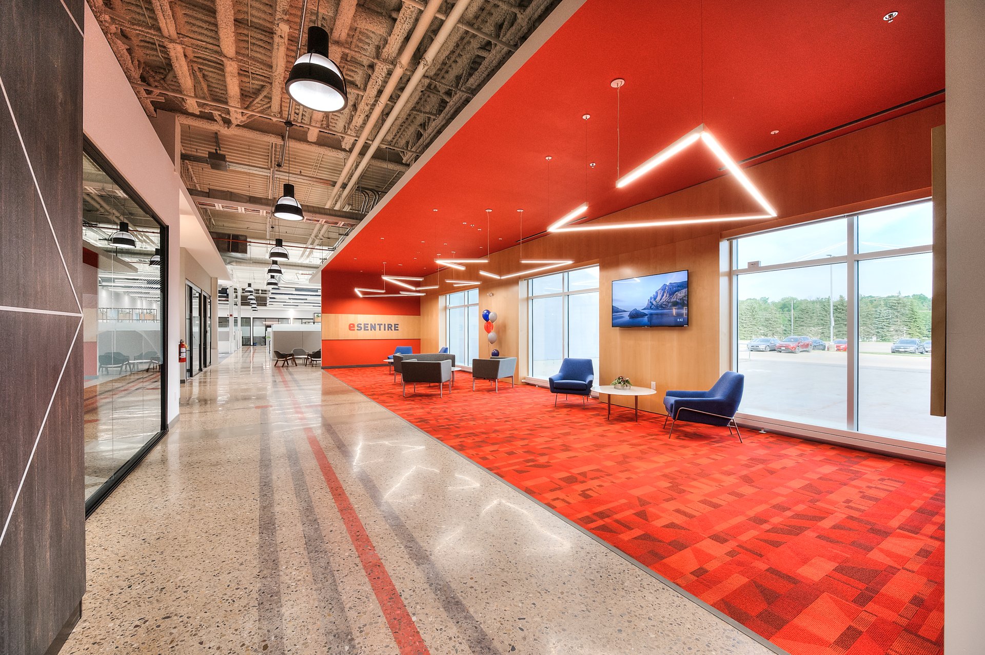 eSentire office conversion with a red feature ceiling and lounge